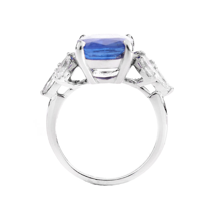 GIA Certified 5.07 Carat Cushion Cut No Heat Burma Sapphire, 1.20 Carat Marquise Cut Diamond and Platinum Ring.