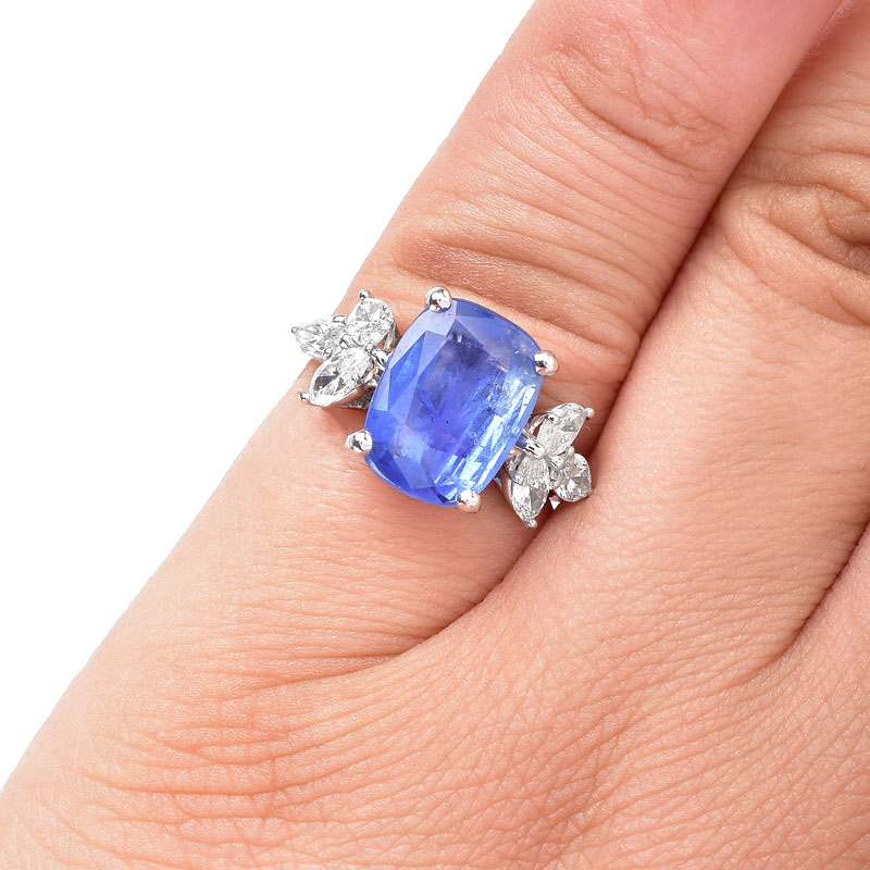 GIA Certified 5.07 Carat Cushion Cut No Heat Burma Sapphire, 1.20 Carat Marquise Cut Diamond and Platinum Ring.