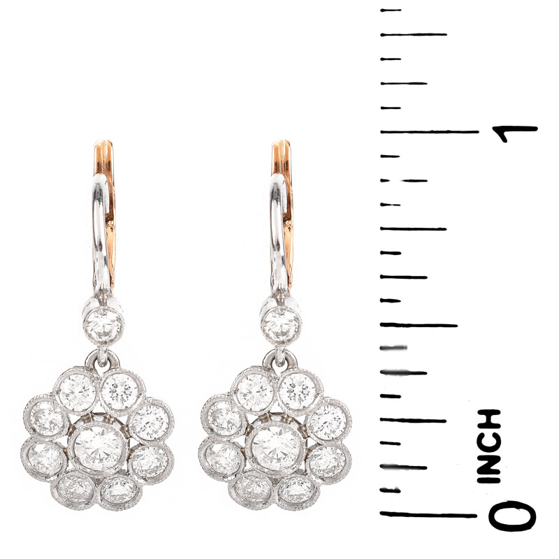 Vintage Approx. 2.04 Carat Round Brilliant Cut Diamond and 14 Karat White and Yellow Gold Dangle Flower Earrings. Diamonds G-H color, VS-SI clarity.