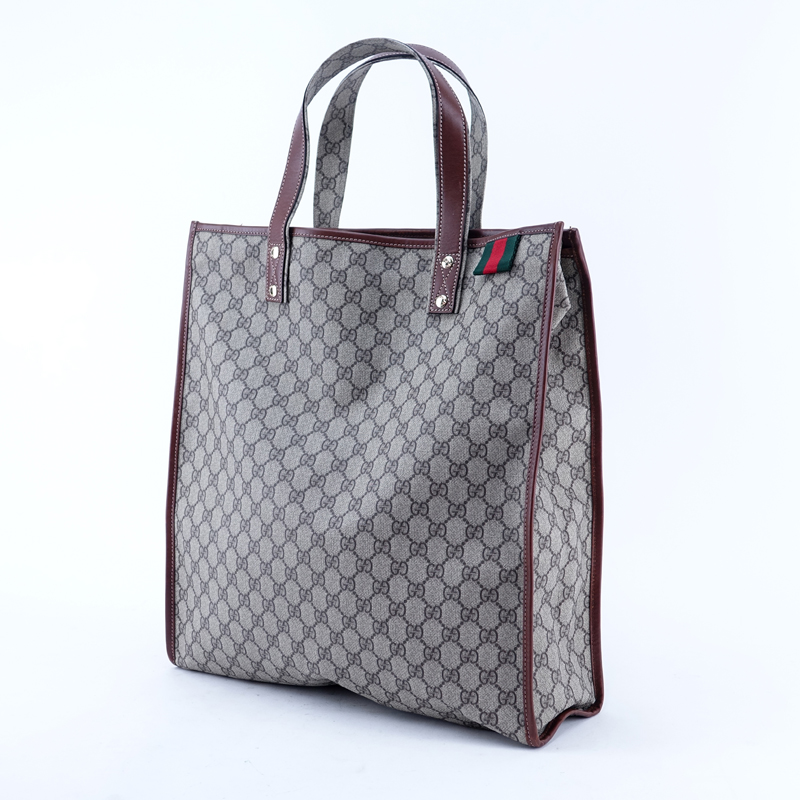 Gucci Beige Supreme Coated Monogram Canvas And Leather Tall Tote. Gold tone hardware.
