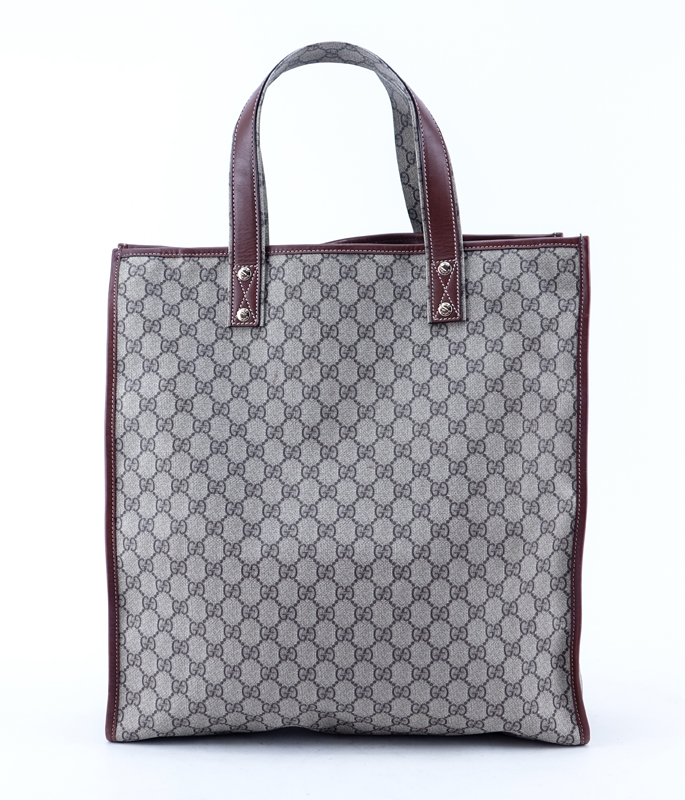 Gucci Beige Supreme Coated Monogram Canvas And Leather Tall Tote. Gold tone hardware.