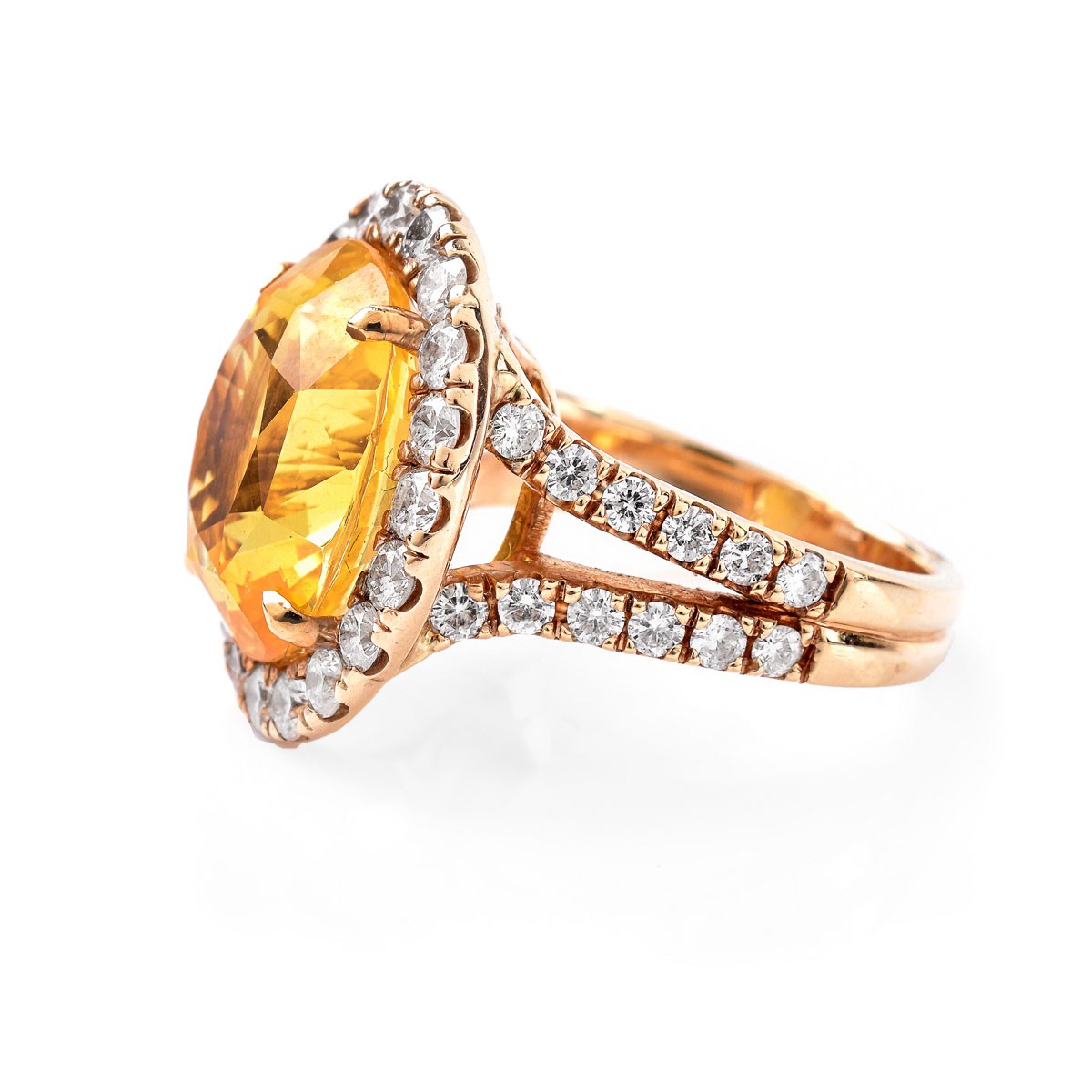 Approx.12.65 Carat Oval Cut Yellow Sapphire, 1.15 Carat Round Brilliant Cut Diamond and 18 Karat Yellow Gold Ring. Sapphire measures 14.58 x 12.36 x 8.43mm.