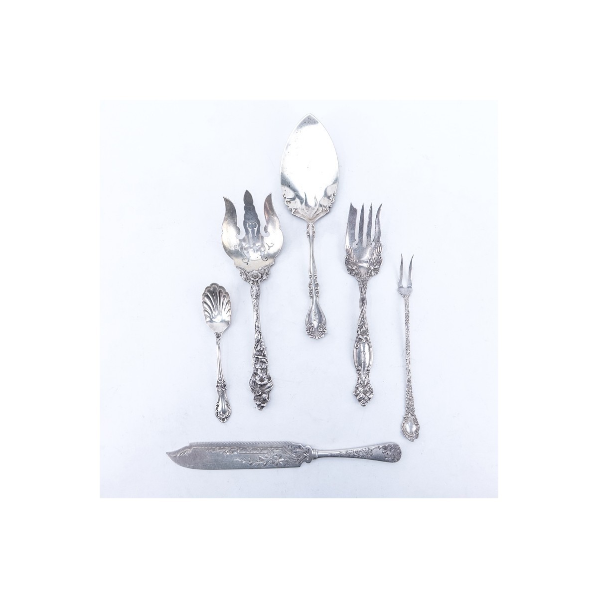 Grouping of Six (6) Antique Sterling Silver: Server 10" L, Shell Bowl Spoon 6-1/8" L, Knife 10-1/4" L, Pierced Serving Fork 9-5/8" L, Serving Fork 8-7/8" L, and Two Tine Serving Fork 8-1/8" L. All appropriately signed.