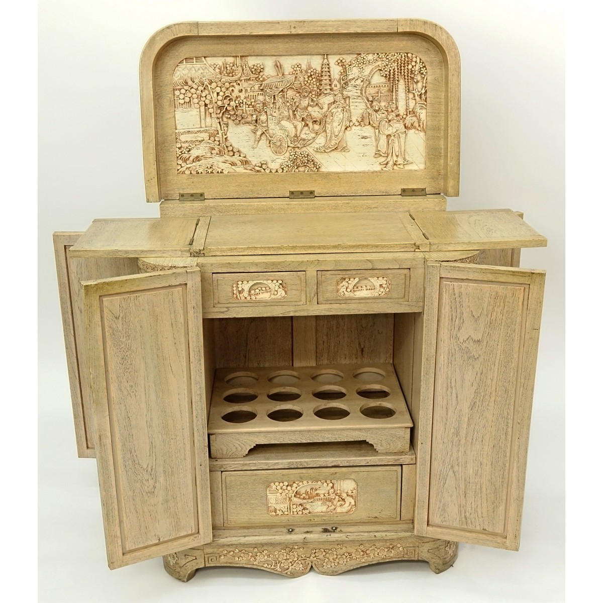 Vintage Chinese Motif Carved Wood Liquor Cabinet. Top lifts to reveal busy carved scene and fold out panels for serving.