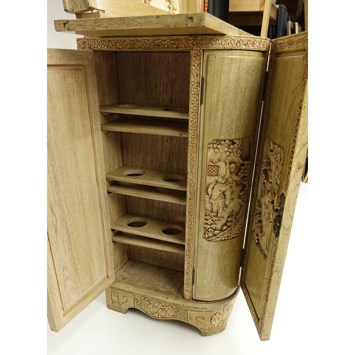 Vintage Chinese Motif Carved Wood Liquor Cabinet. Top lifts to reveal busy carved scene and fold out panels for serving.