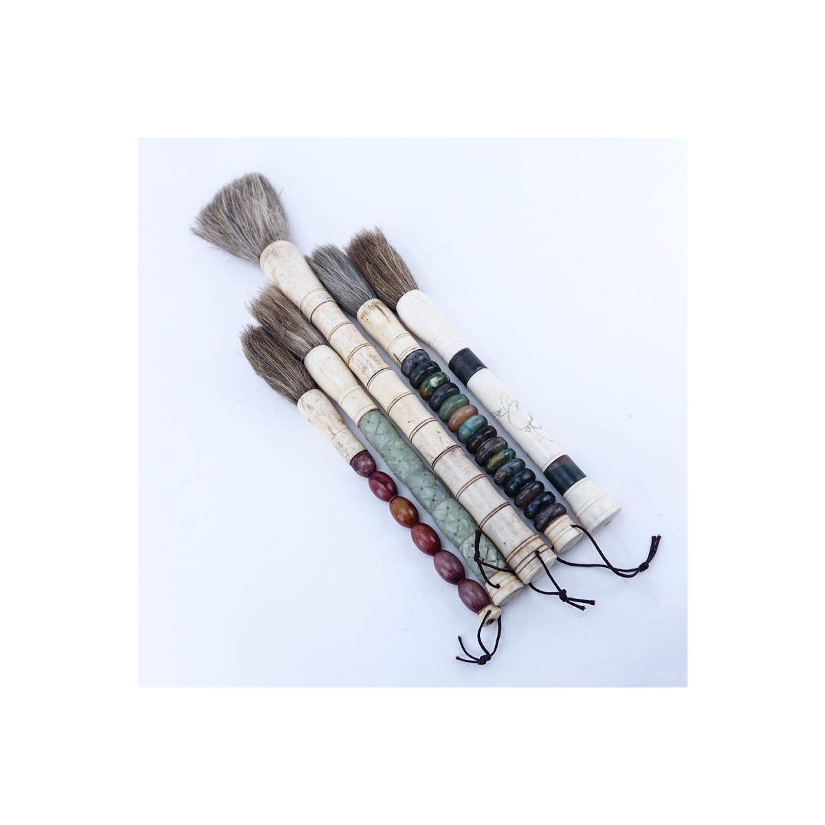 Grouping of Five (5) Antique Chinese Calligraphy Brushes with Bone, Jade, or Carnelian as Handles. Good condition.