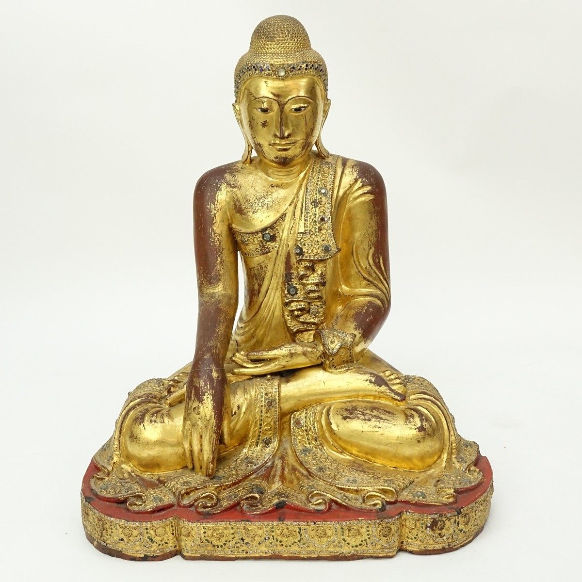 Large Burmese Gilt Painted and Glass Beaded Seated Buddha Sculpture. Typical age splits to wood, rubbing throughout, a few missing glass beads.