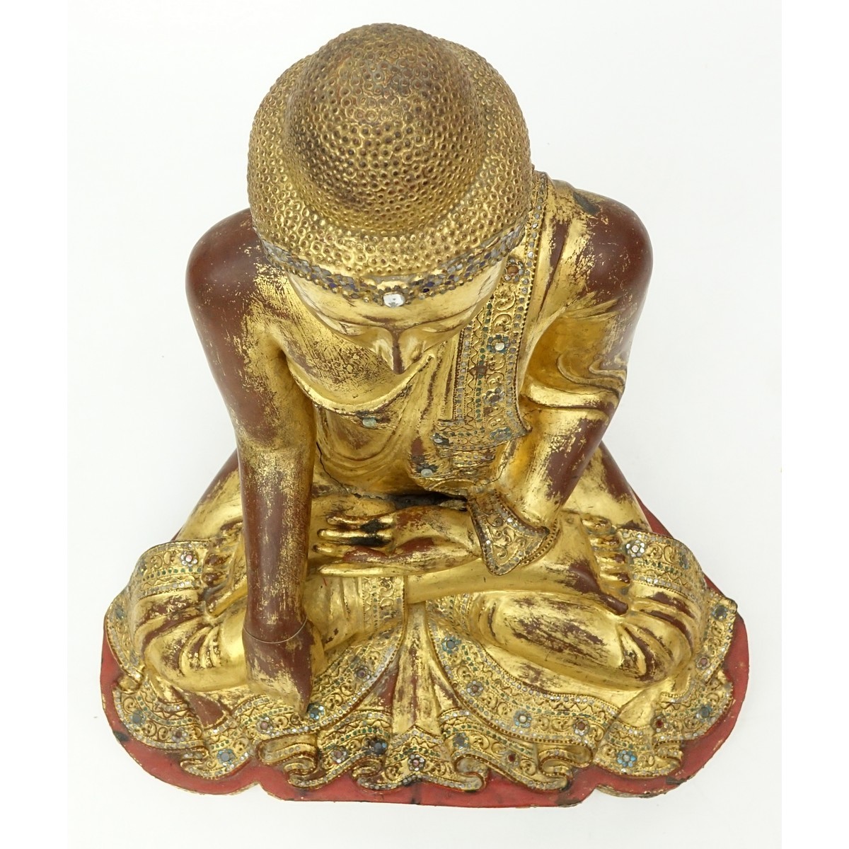 Large Burmese Gilt Painted and Glass Beaded Seated Buddha Sculpture. Typical age splits to wood, rubbing throughout, a few missing glass beads.