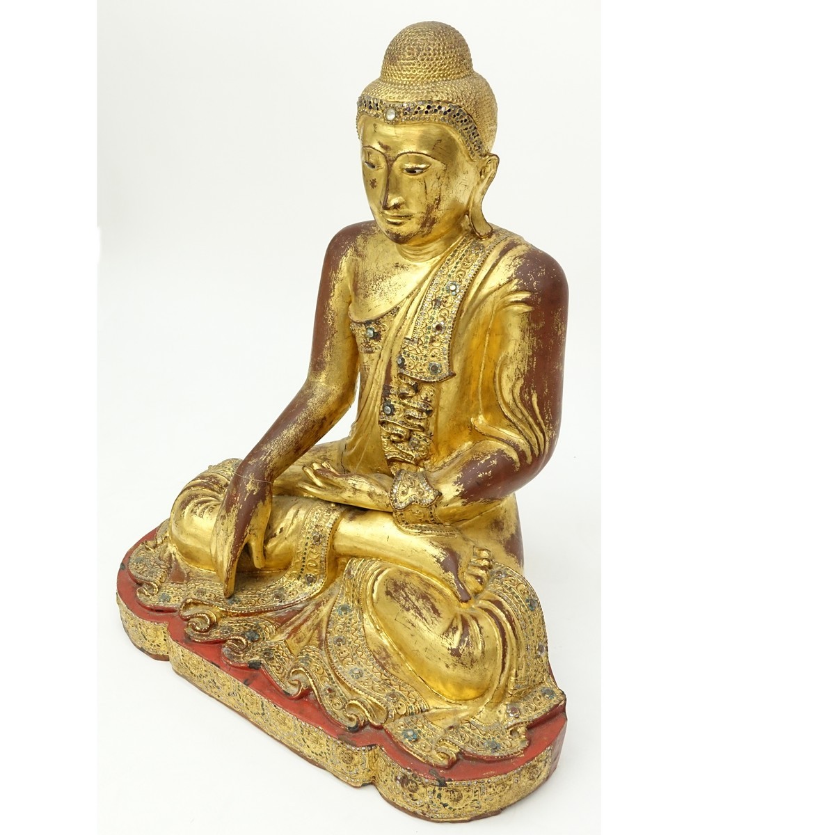 Large Burmese Gilt Painted and Glass Beaded Seated Buddha Sculpture. Typical age splits to wood, rubbing throughout, a few missing glass beads.