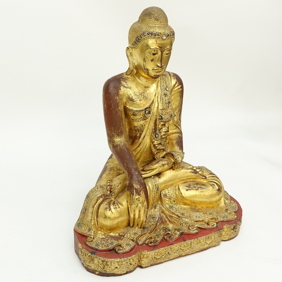 Large Burmese Gilt Painted and Glass Beaded Seated Buddha Sculpture. Typical age splits to wood, rubbing throughout, a few missing glass beads.