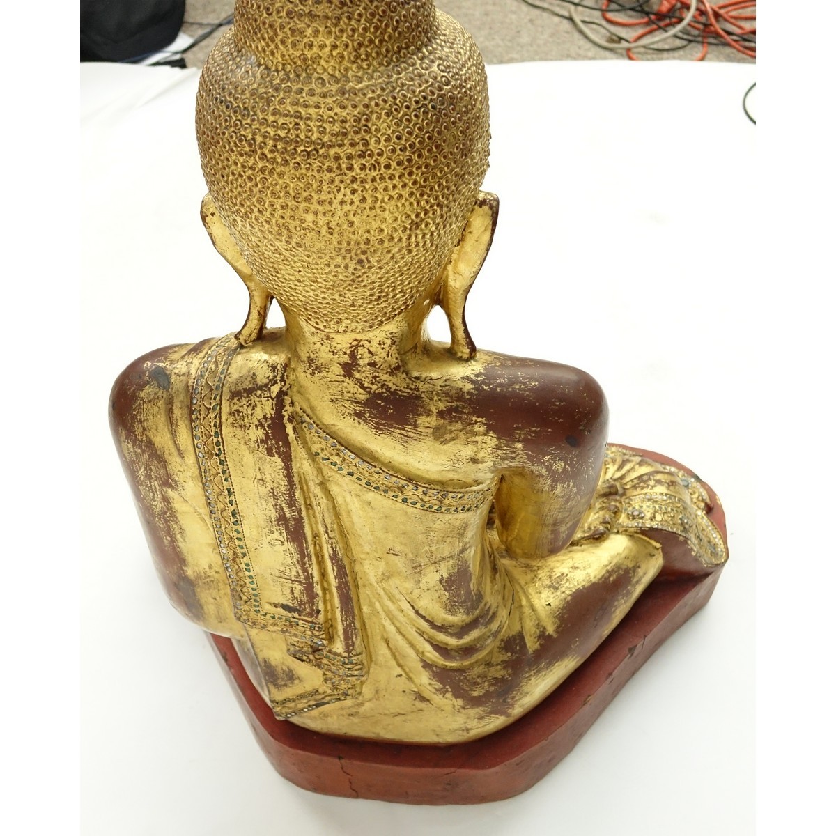 Large Burmese Gilt Painted and Glass Beaded Seated Buddha Sculpture. Typical age splits to wood, rubbing throughout, a few missing glass beads.