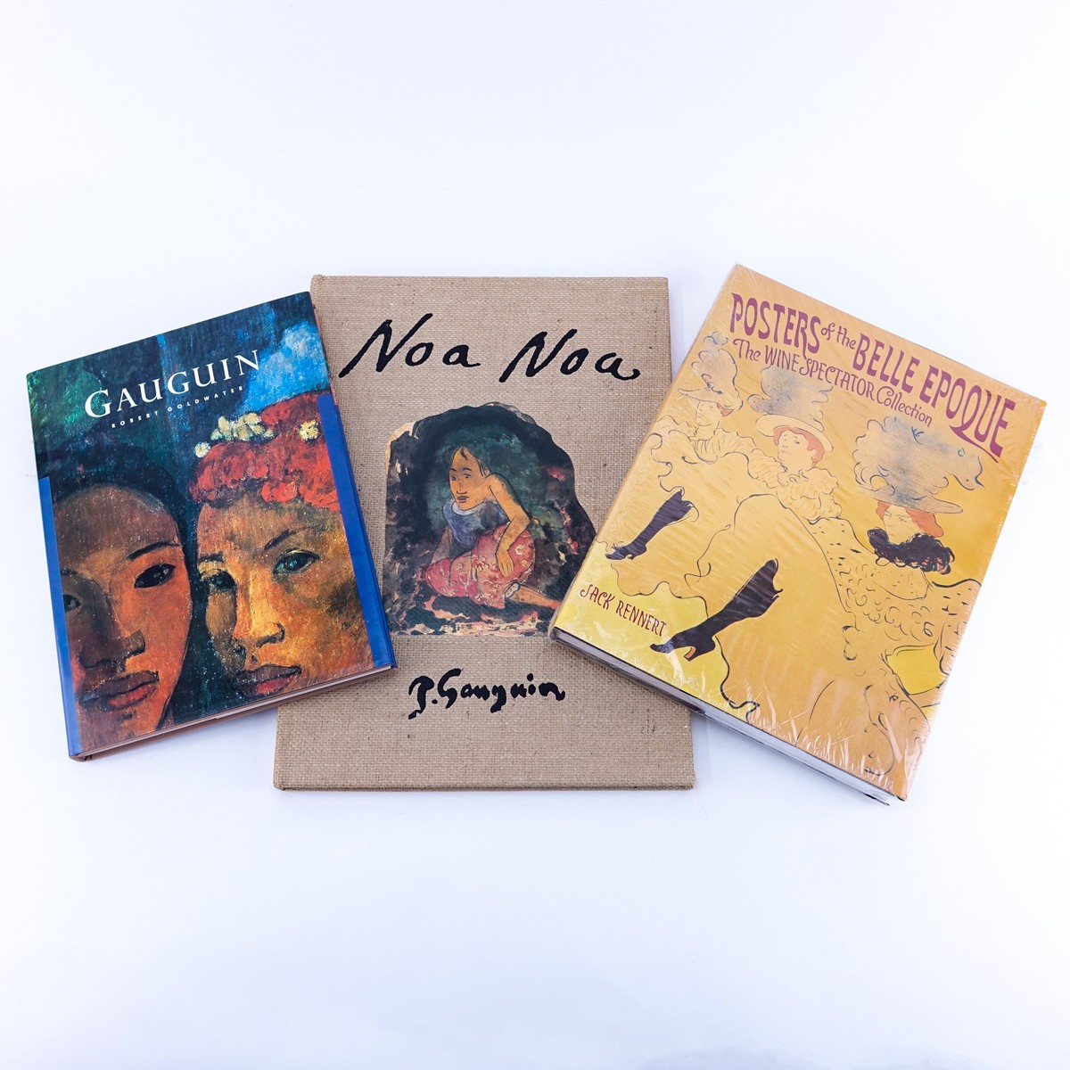 Grouping of Three (3): Paul Gauguin Hardcover book by Robert Coldwater, Paul Gauguin Noa Noa Edition Hardcover Book, and Posters of the Belle Époque: The Wine Spectator Collection Hardcover Book by Jack Rennert. All in good used condition.