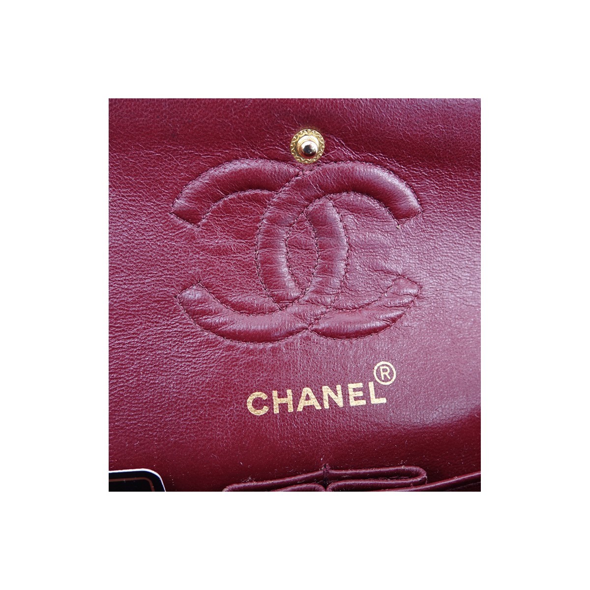 Chanel Black Quilted Leather Classic Double Flap 23 Handbag. Gold tone hardware, burgundy leather interior with patch and zippered pockets.