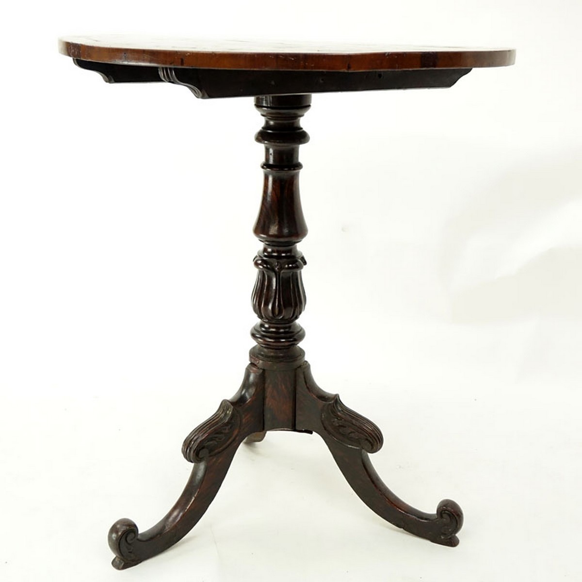 Queen Anne Mahogany Round Tilt Top Table. Carved baluster form stem standing on tri pod feet.