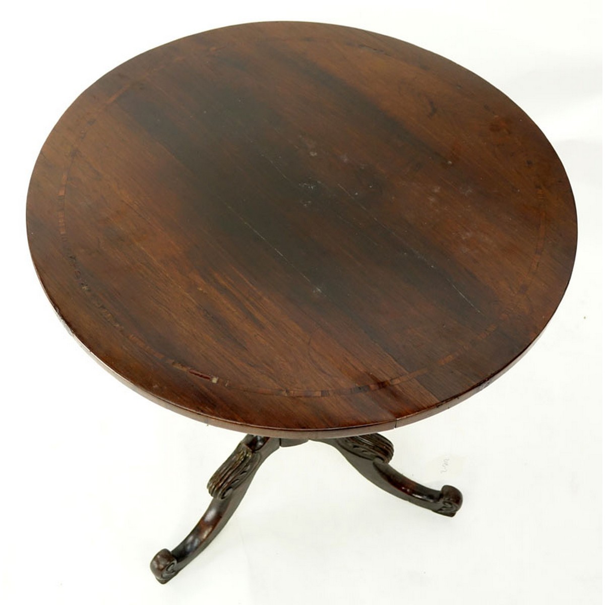 Queen Anne Mahogany Round Tilt Top Table. Carved baluster form stem standing on tri pod feet.