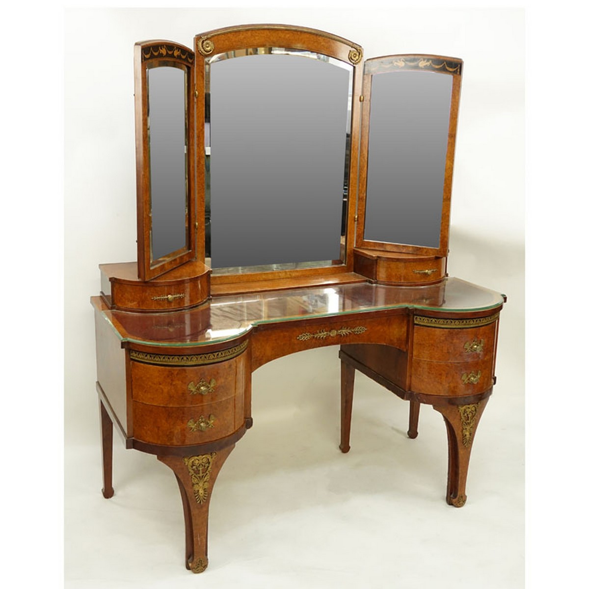 Antique Style French Burlwood Inlaid Gilt Brass Mounted Lady's Dressing Table Mirror. Total of seven drawers, three panel mirror, standing tapering bracket legs.