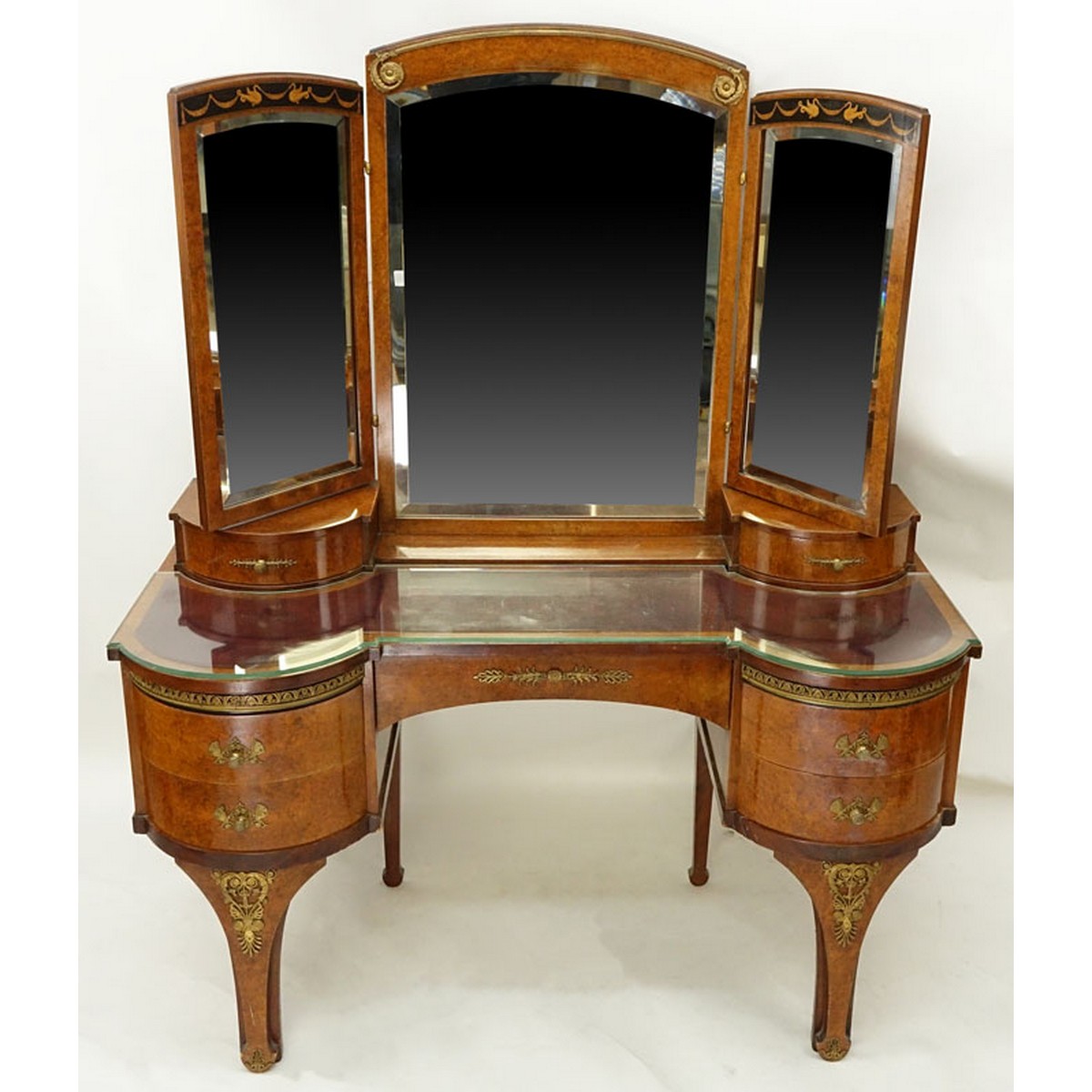 Antique Style French Burlwood Inlaid Gilt Brass Mounted Lady's Dressing Table Mirror. Total of seven drawers, three panel mirror, standing tapering bracket legs.