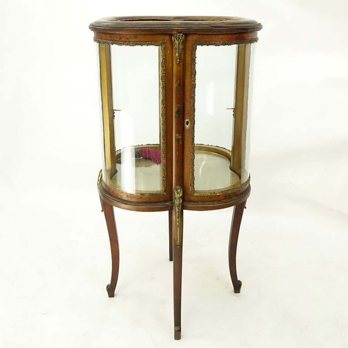 20th Century French Gilt and Floral Painted Vitrine with Brass Fittings. Two large curved fitted doors with single glass shelve, key included.