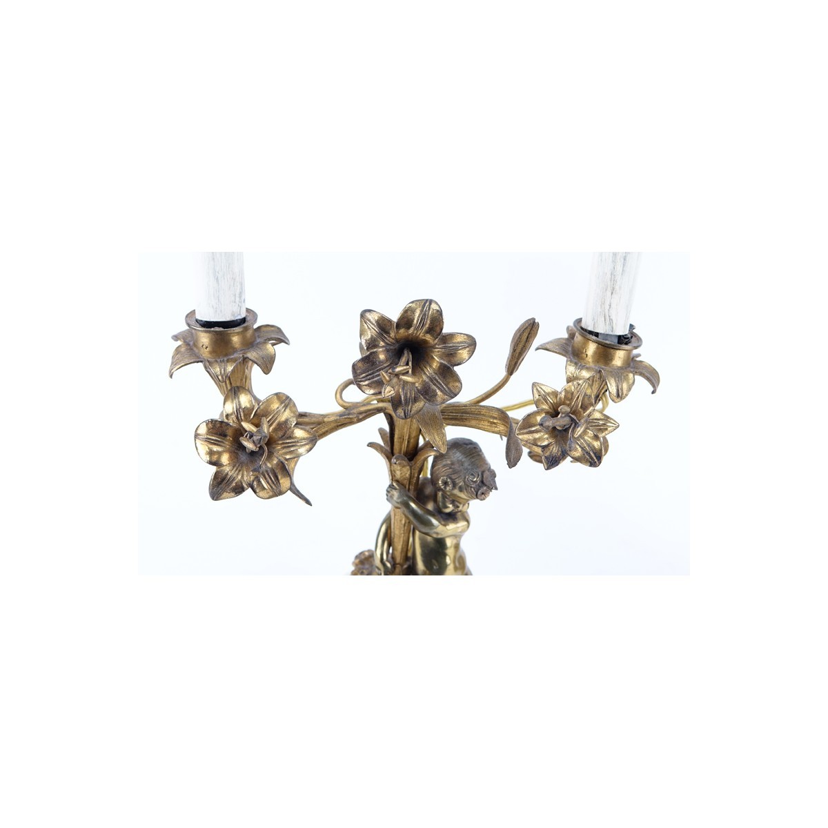 Pair of Gilt Brass Putti Two Light Electrified Candelabras. Each have been repaired, residue to surface, rubbing to gilt.