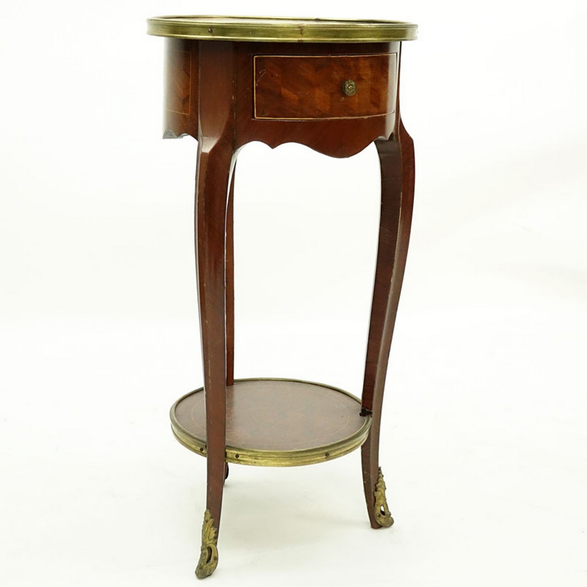 20th Century French Louis XVI Style Parquetry Inlaid Gilt Brass Round Side Table. Single fitted sliding drawer with shelf stretcher.