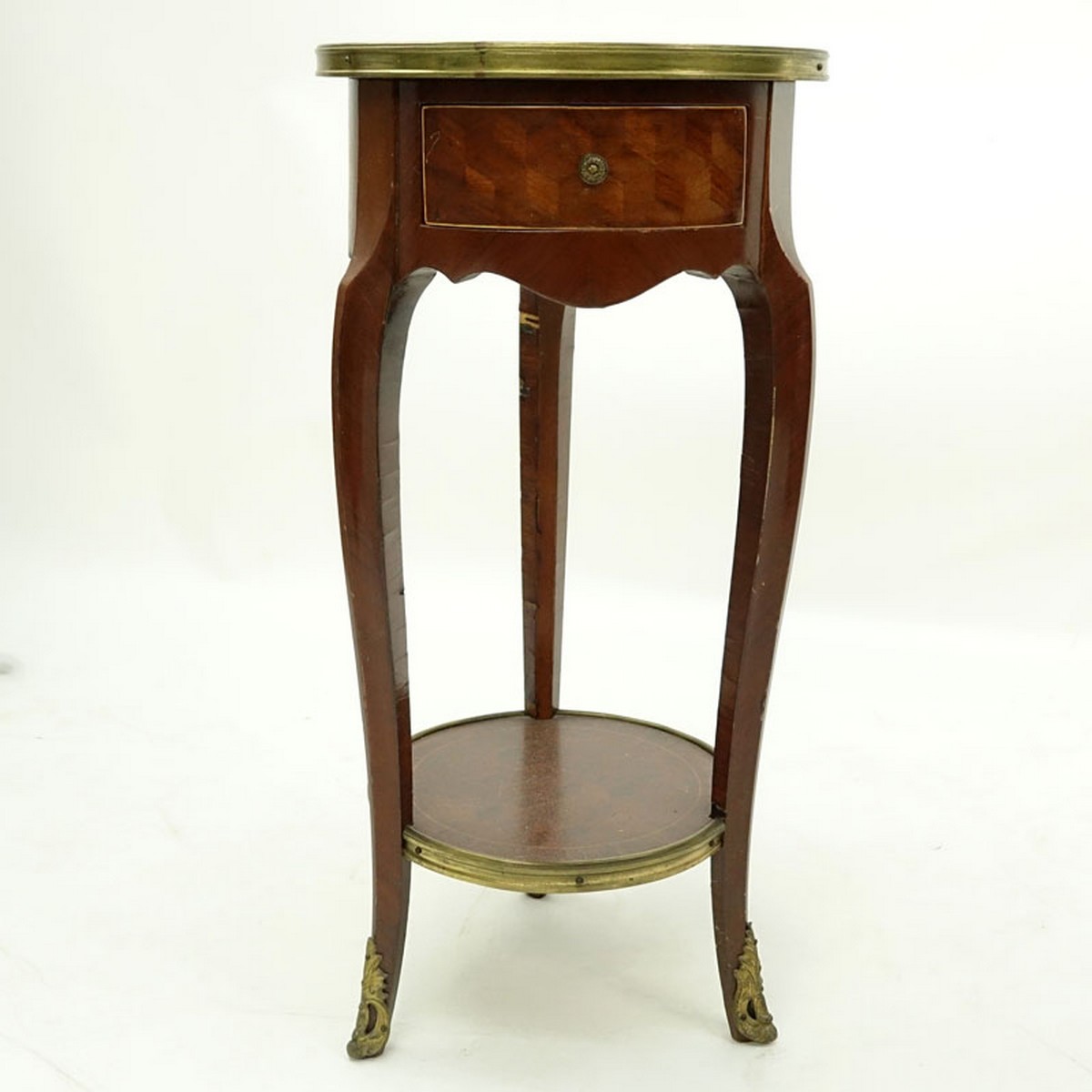 20th Century French Louis XVI Style Parquetry Inlaid Gilt Brass Round Side Table. Single fitted sliding drawer with shelf stretcher.