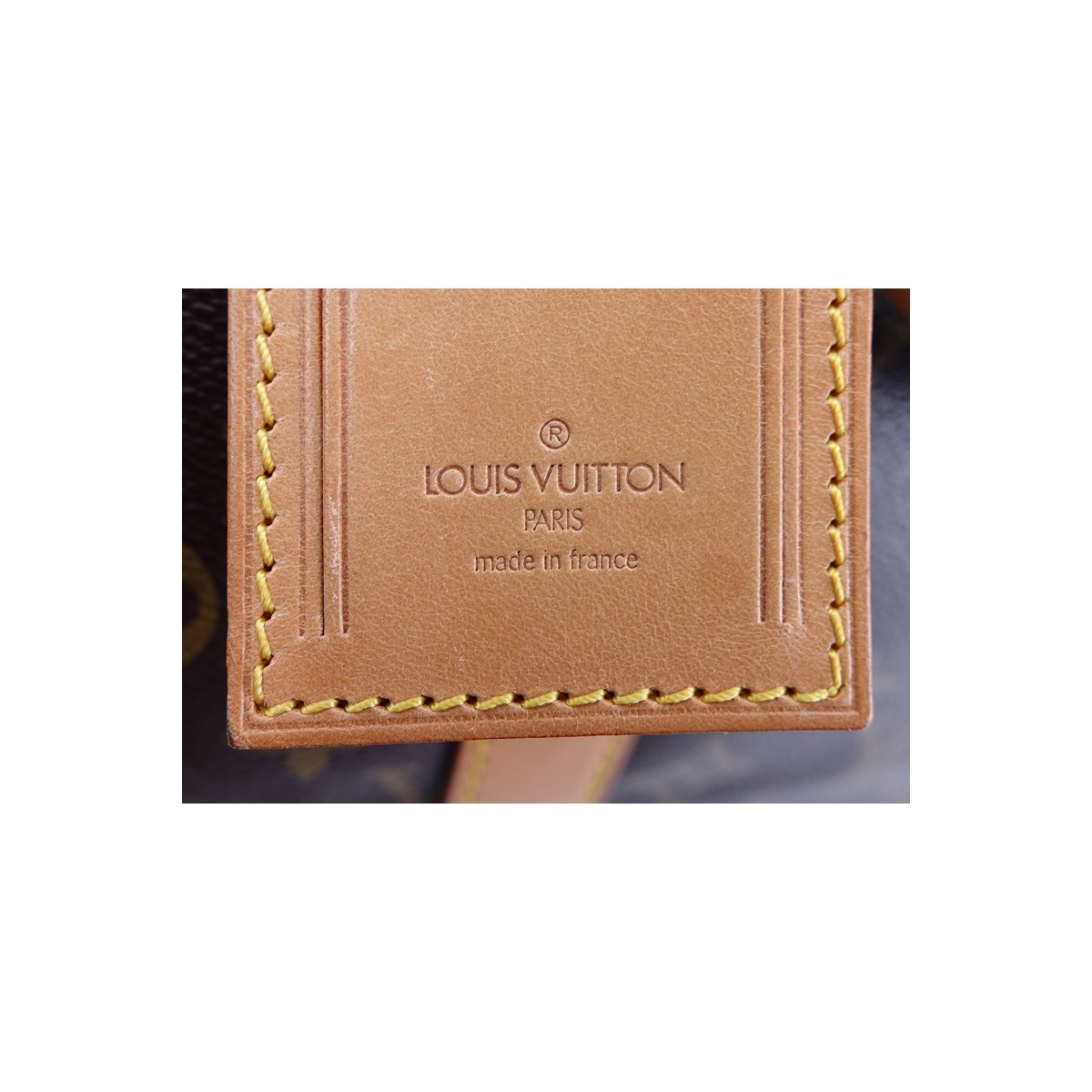 Louis Vuitton Brown Monogram Coated Canvas Keepall Travel Bag 55. Golden brass hardware.