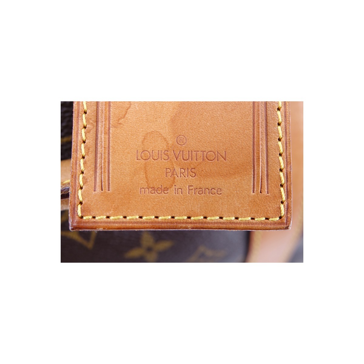 Louis Vuitton Brown Monogram Coated Canvas Keepall Bandouliere 50. Golden brass hardware.