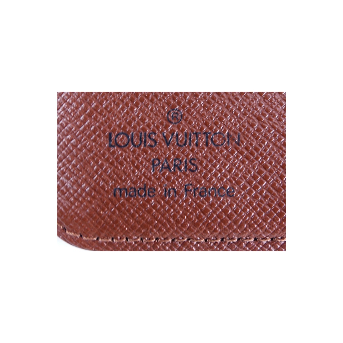 Louis Vuitton Brown Monogram Coated Canvas Compact Zip Wallet. Golden brass hardware, brown interior with zipper and slot pockets.