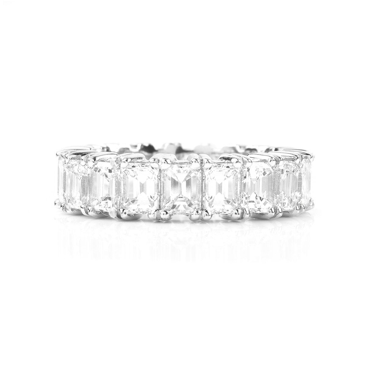 Approx. 7.0 Carat Emerald Cut Diamond and Platinum Eternity Band.