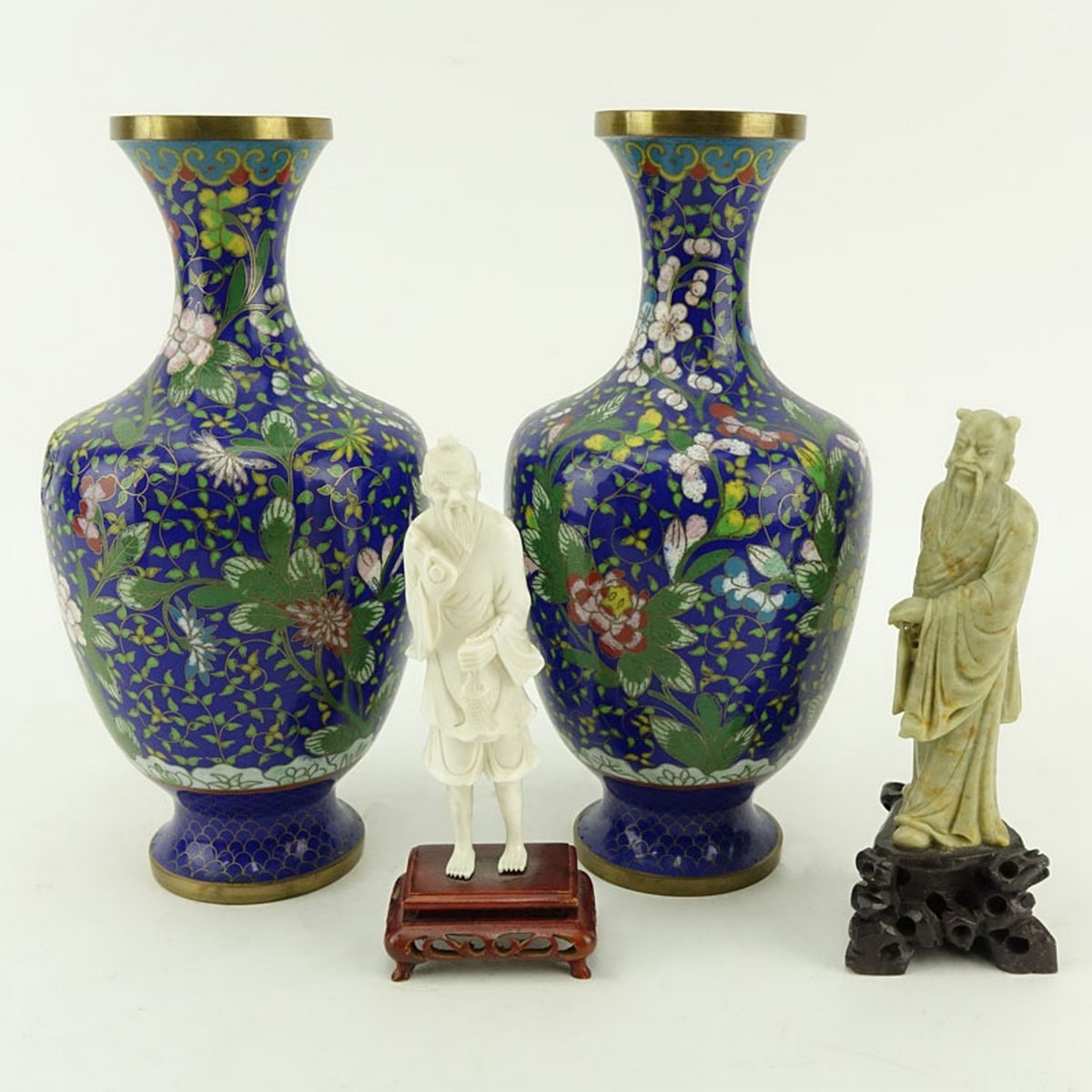 Grouping of Four (4): Pair of Chinese Cloisonne Vases, Chinese Carved Ivory Figurine, and Chinese Soapstone Figurine. Dent to one vase, ivory figure has a small loss to object and to top of the head.