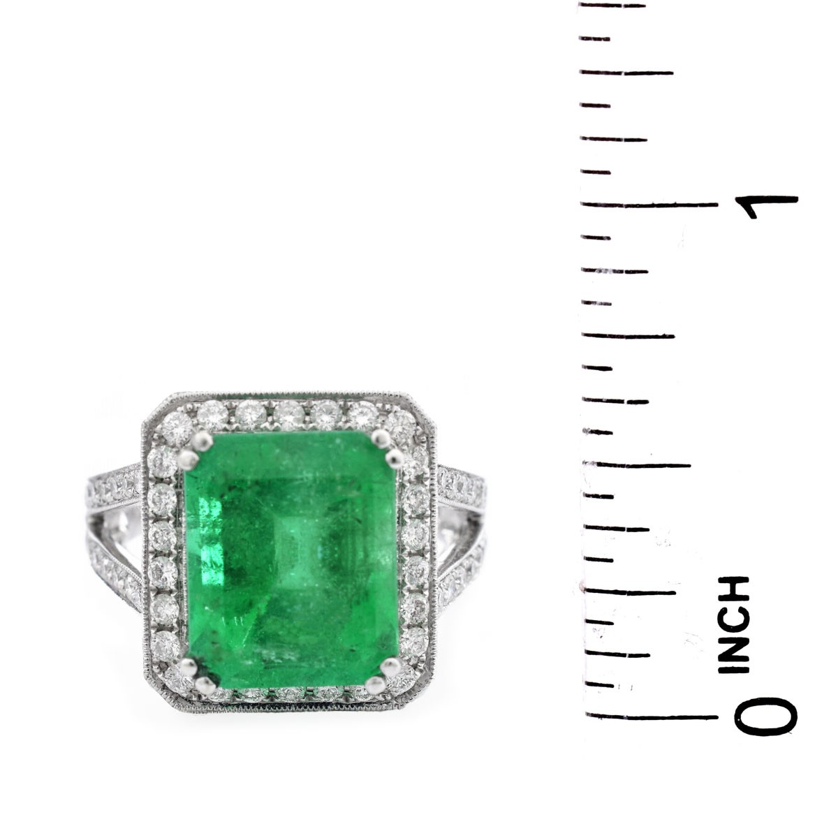 Approx. 6.35 Carat Colombian Emerald, 1.75 Carat Round Brilliant Cut Diamond and 18 Karat White Gold Ring.