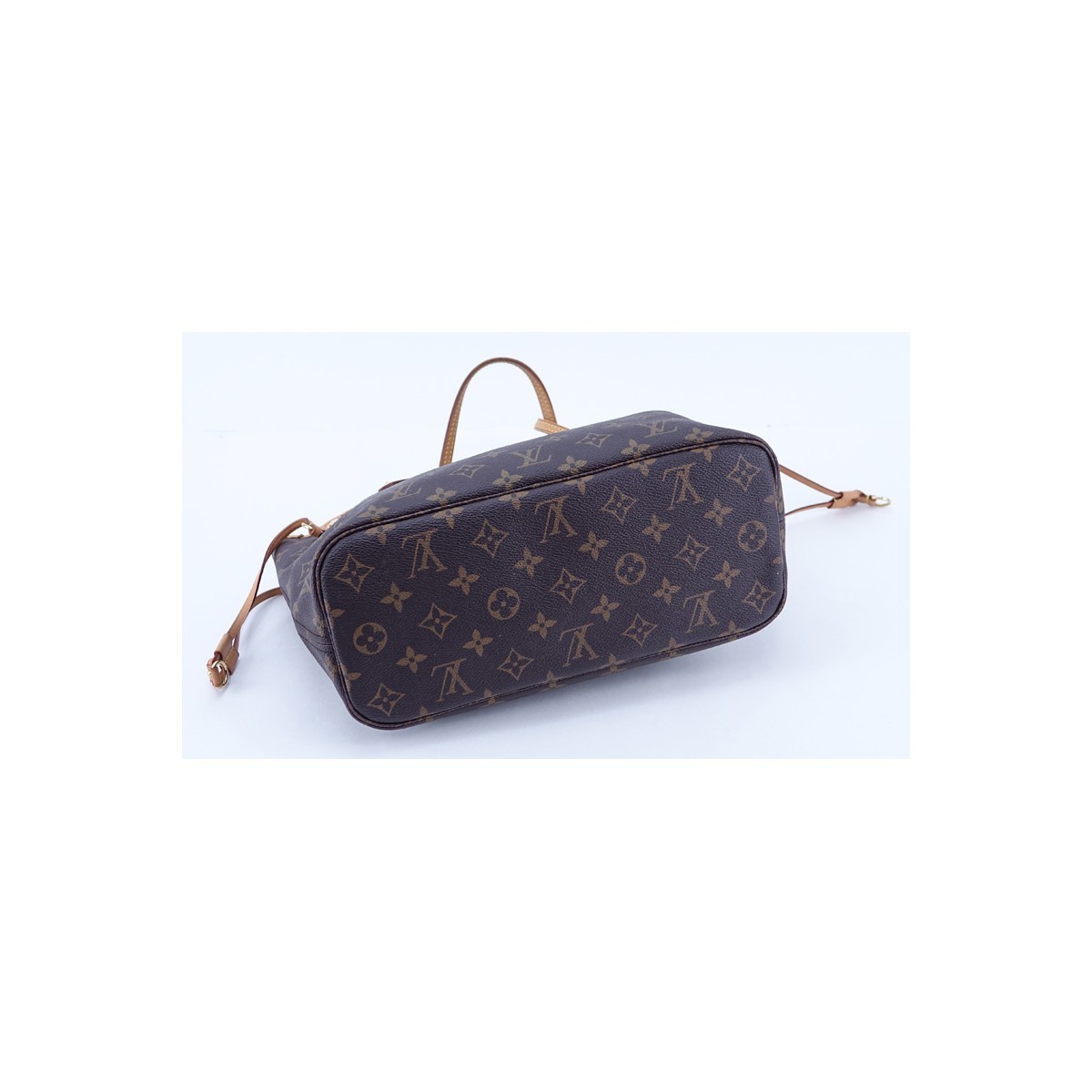 Louis Vuitton Brown Monogram Coated Canvas And Leather Neverfull PM Handbag. Golden brass hardware, signature canvas interior with zippered pocket, vachetta straps.