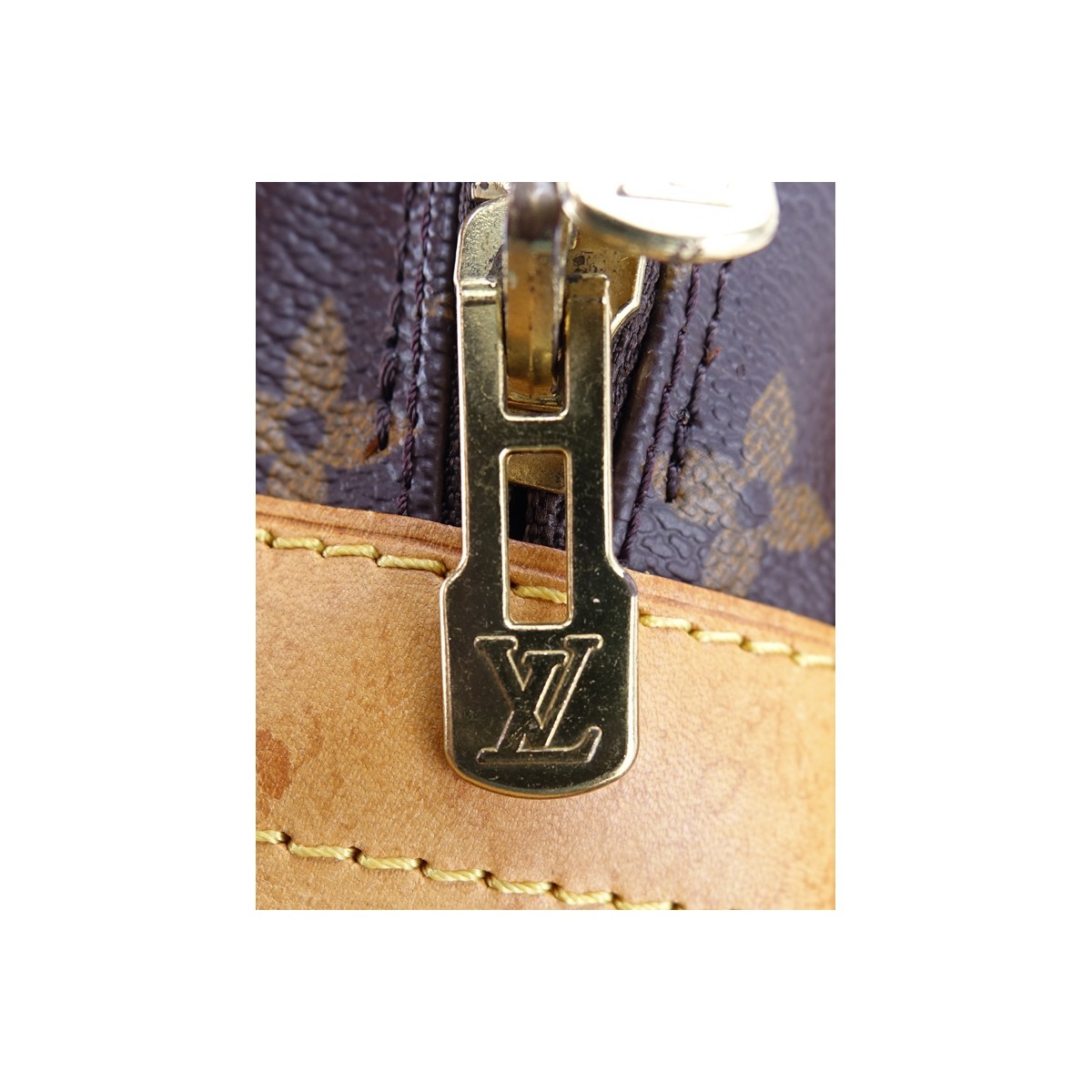 Louis Vuitton Brown Monogram Coated Canvas  Voyage Porte-Documents. Golden brass hardware, brown interior with zippered and various patch pockets.