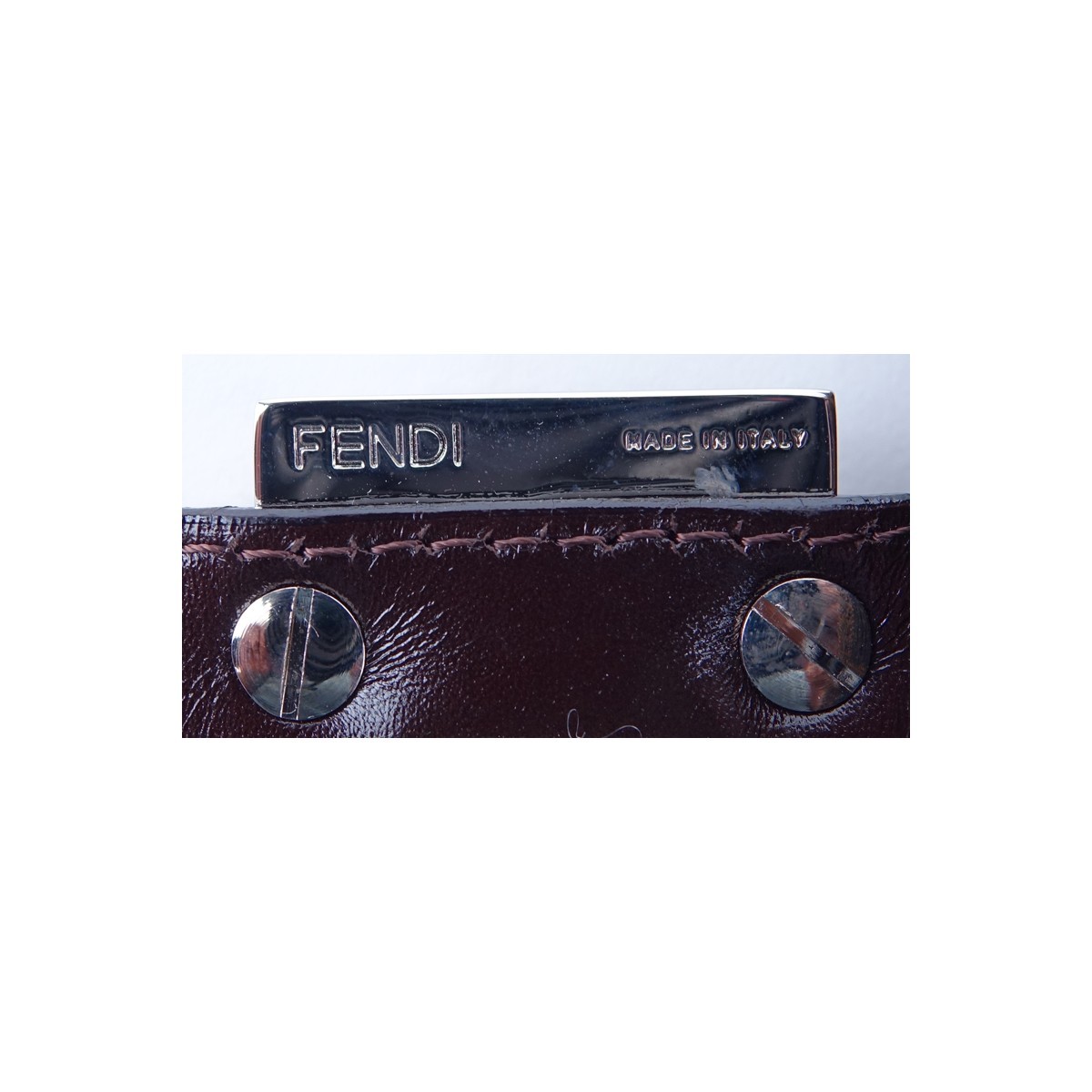 Fendi Brown Monogram Canvas Baguette Handbag. Silvertone hardware, interior of dark brown canvas with zippered pocket.