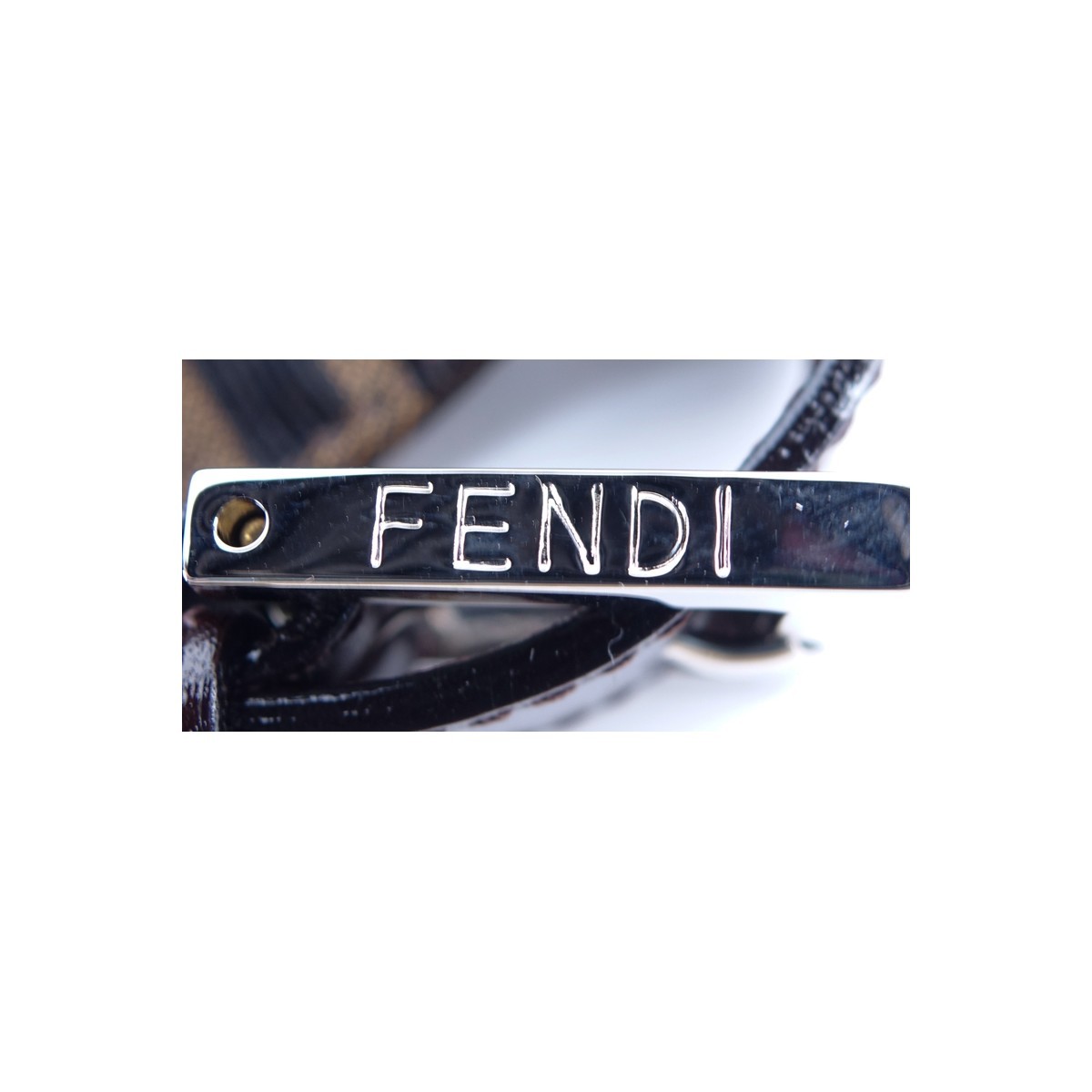 Fendi Brown Monogram Canvas Baguette Handbag. Silvertone hardware, interior of dark brown canvas with zippered pocket.