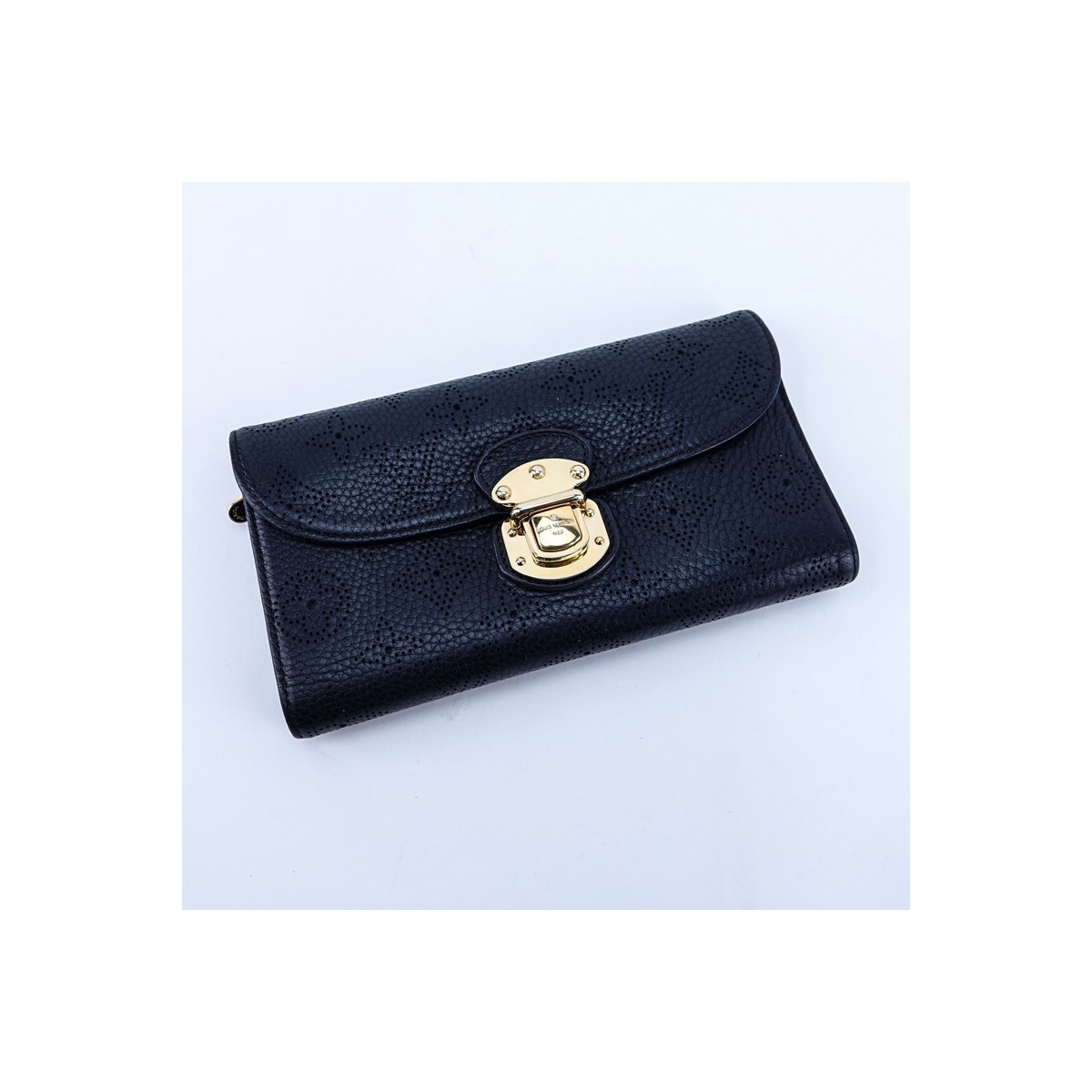 Louis Vuitton Black Monogram Empreinte Leather Amelia Wallet. Golden brass hardware, interior card slots and zippered pocket.