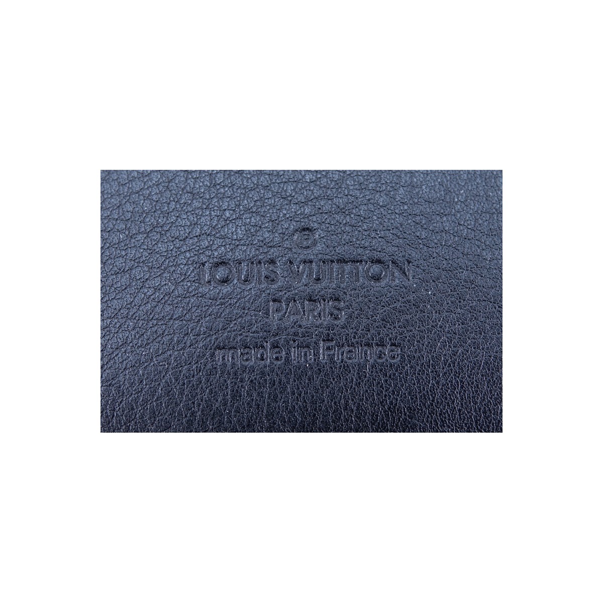 Louis Vuitton Black Monogram Empreinte Leather Amelia Wallet. Golden brass hardware, interior card slots and zippered pocket.