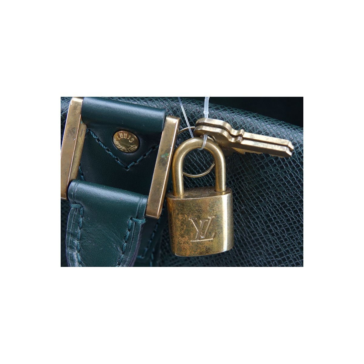 Louis Vuitton Dark Green Tiaga Leather Kendall PM Travel Bag. Golden Brass Hardware, green leather interior, canvas shoulder strap, leather luggage tag, cadenas & keys.