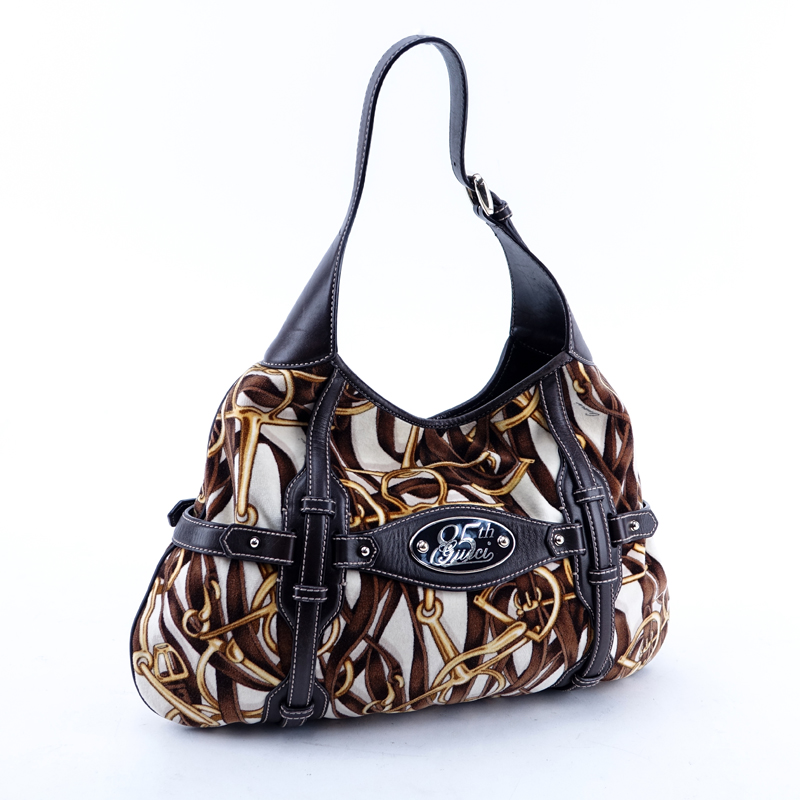 Gucci Brown/White/Gold Velvet And Leather Bridal Bit Hobo Bag. Gold tone hardware, monogram canvas interior with zippered pocket.
