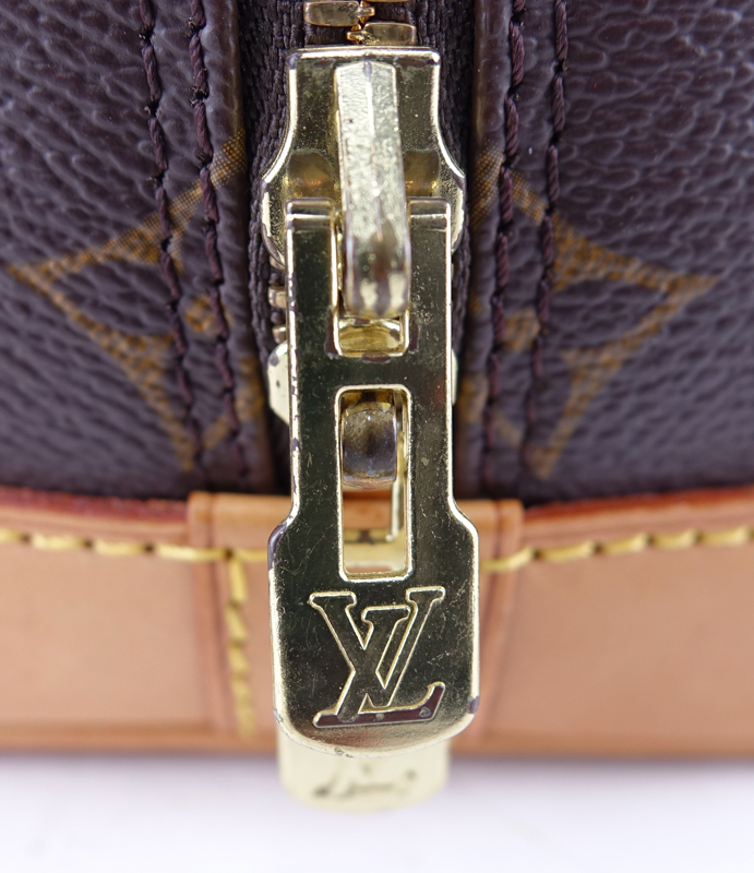 Louis Vuitton Brown Monogram Coated Canvas Alma PM Tote. Golden brass hardware, vachetta straps.