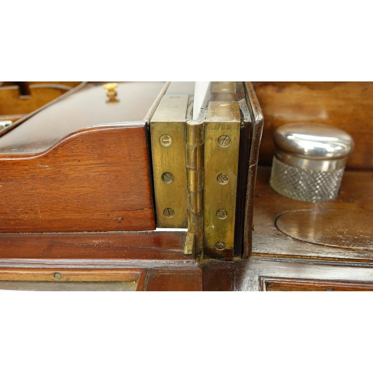 Attributed to: George Betjeman & Sons Circa 1910 Edwardian Mahogany Enclosed Dressing Table. The rectangular hinged top enclosing an interior fitted with three beveled mirror plates, above two hinged compartments flanked by two glass slides and a recessed