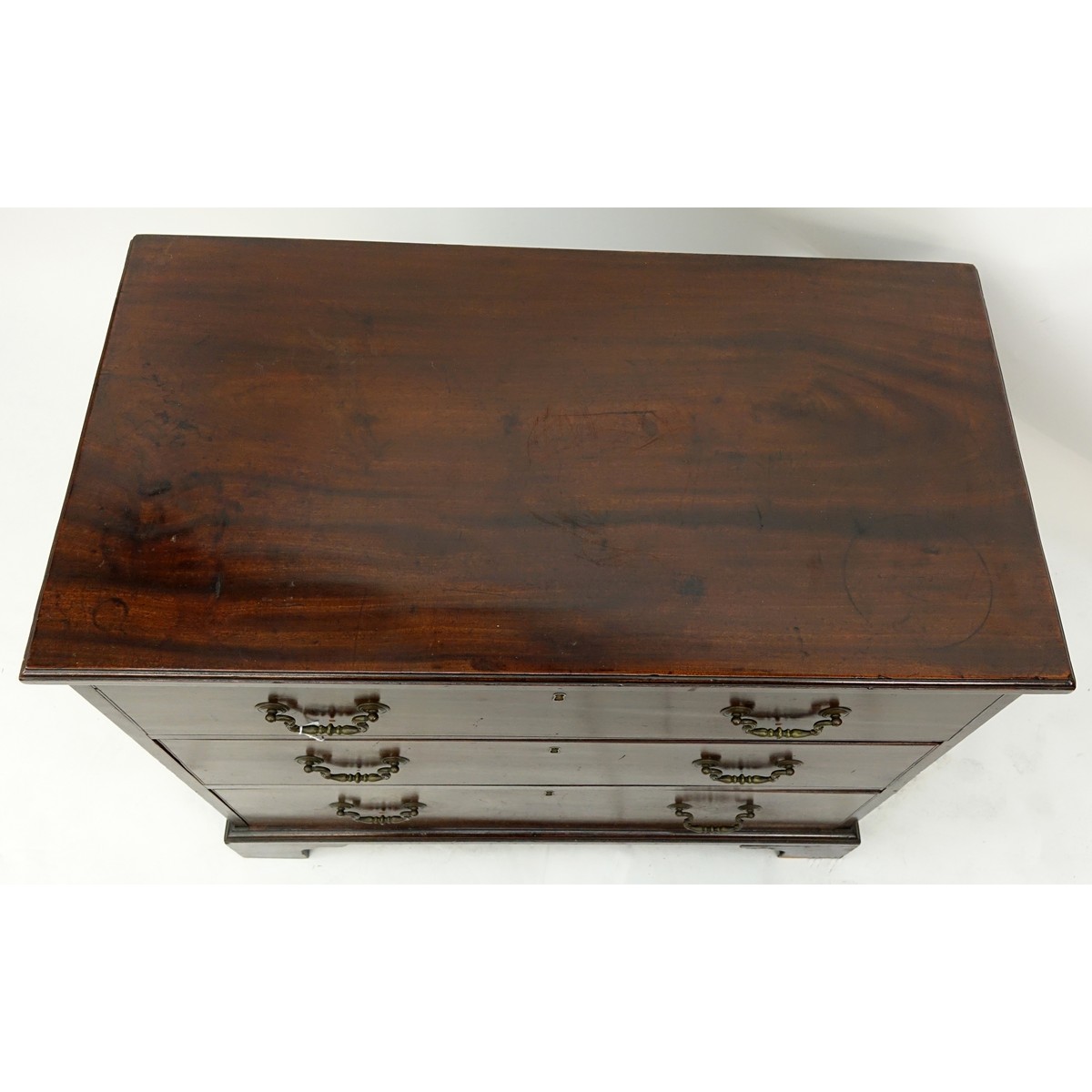 19th Century English Georgian Mahogany Chest of Drawers/Commode. Three large sliding drawers with bracket feet.