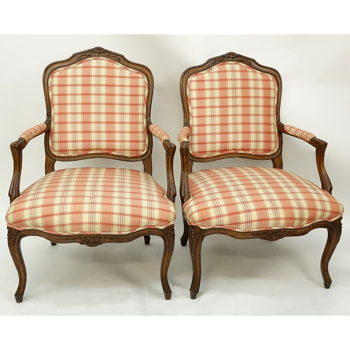 Pair of 20th Century French Louis XV Style Carved Wood and Upholstered Fauteuils. Typical scratches to frame.