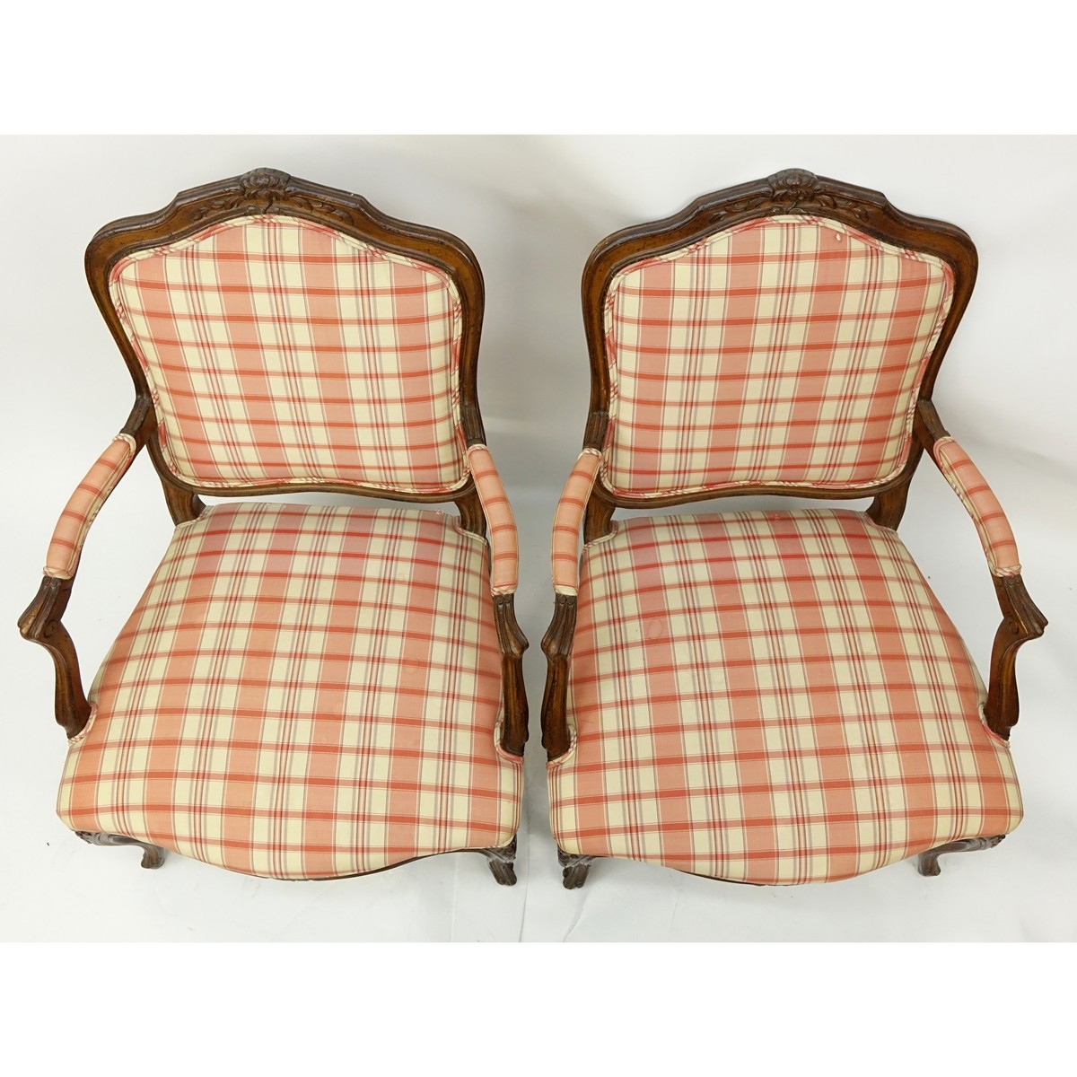 Pair of 20th Century French Louis XV Style Carved Wood and Upholstered Fauteuils. Typical scratches to frame.