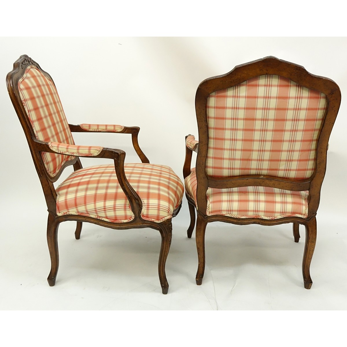 Pair of 20th Century French Louis XV Style Carved Wood and Upholstered Fauteuils. Typical scratches to frame.