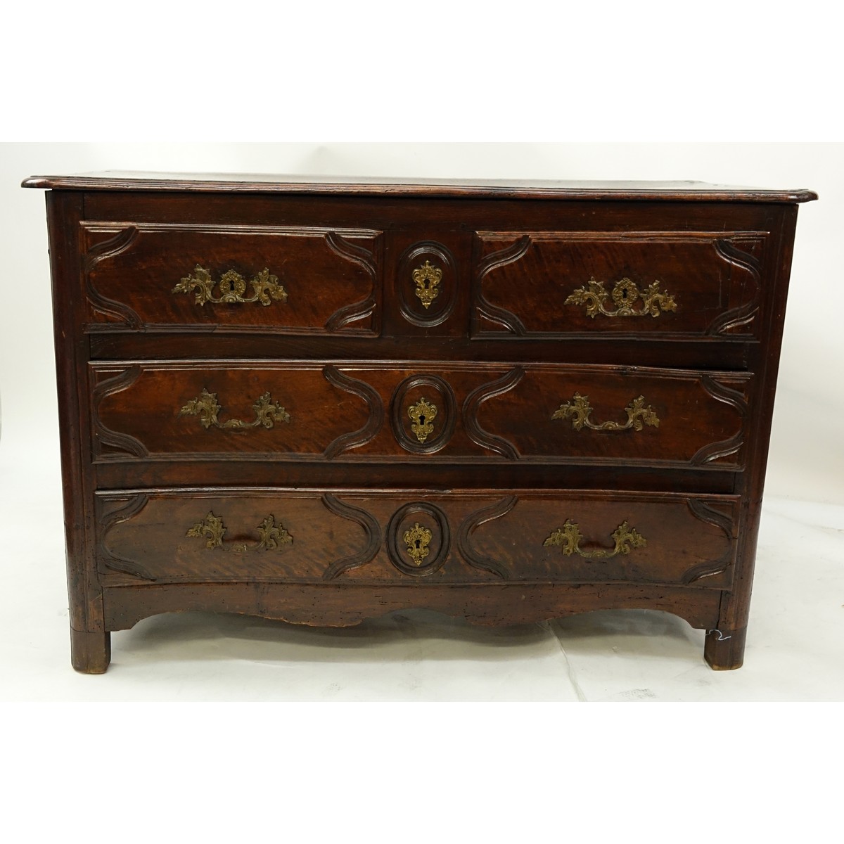 18/19th Century French Bronze Mounted, Carved Walnut Commode/Chest of Drawers. Two short sliding drawers with two large drawers, stands on bracket feet.