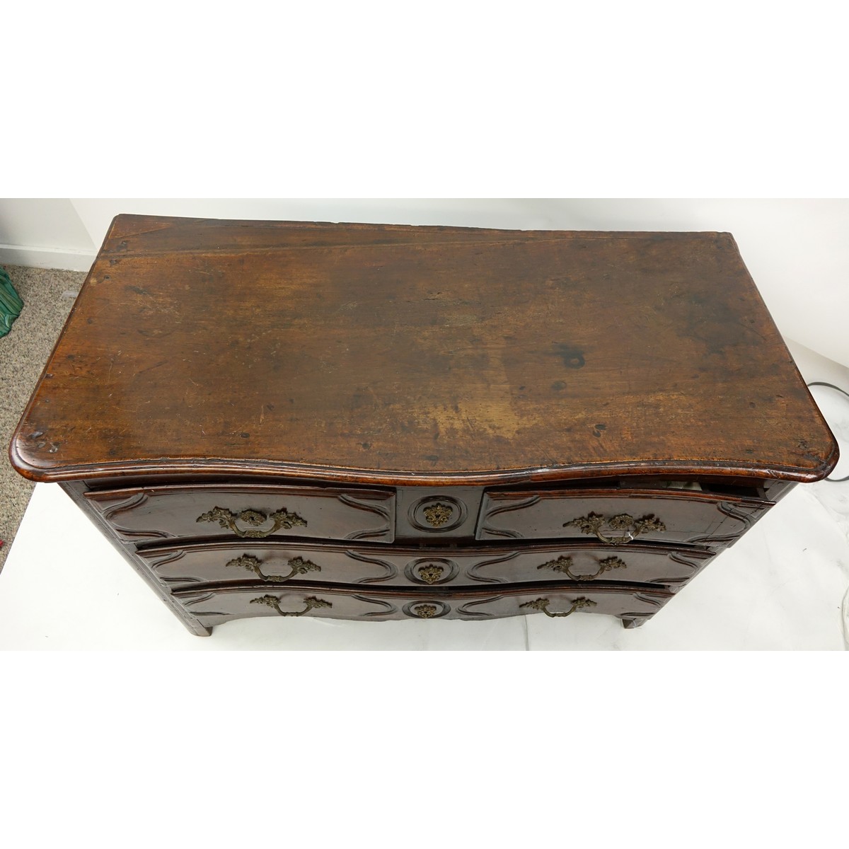 18/19th Century French Bronze Mounted, Carved Walnut Commode/Chest of Drawers. Two short sliding drawers with two large drawers, stands on bracket feet.
