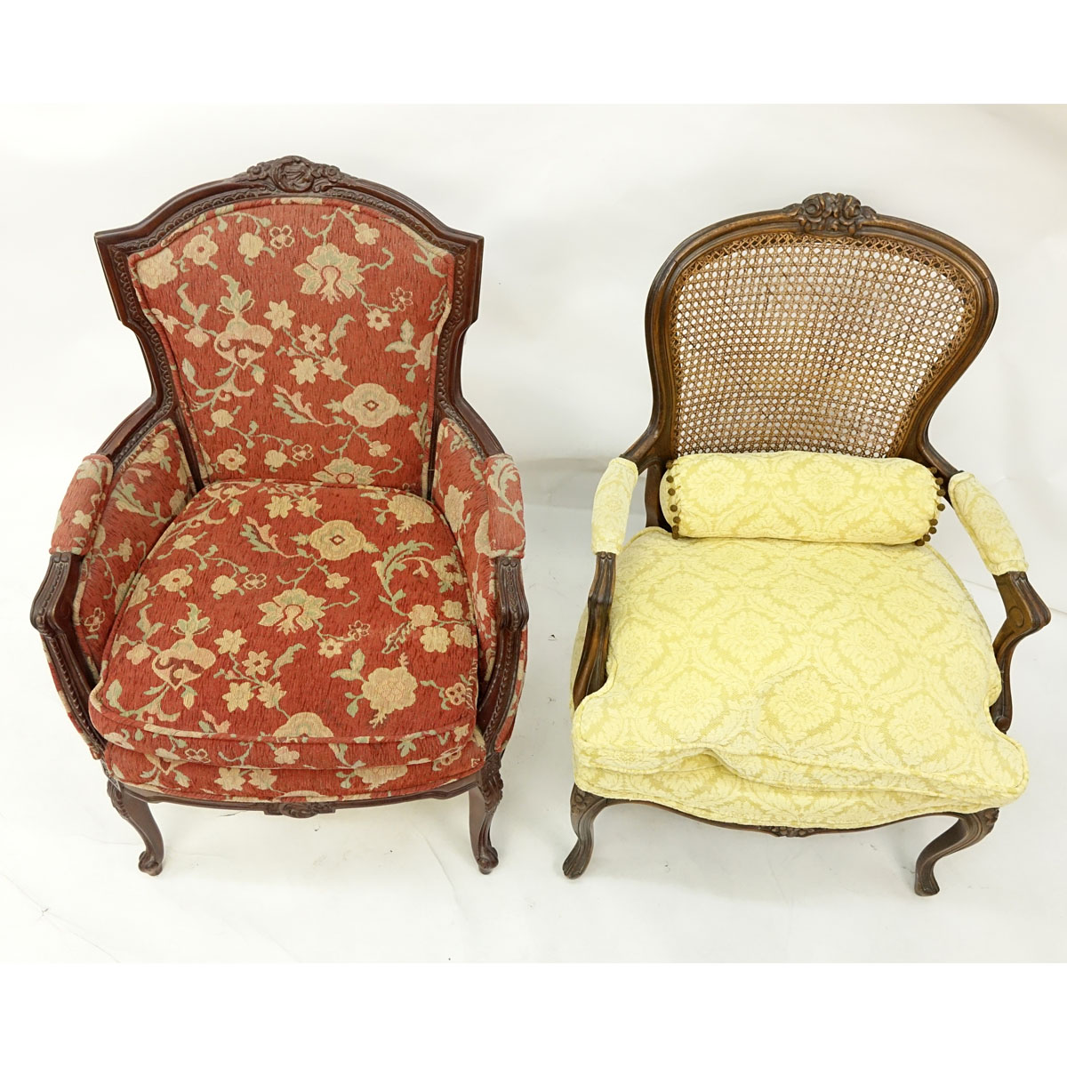 Two (2) 20th Century French Carved Louis XV style Chairs, Fauteuil with Cane Back and Bergere. Unsigned.