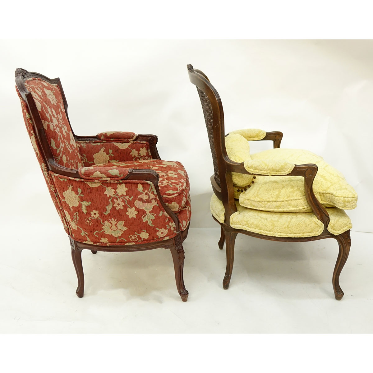 Two (2) 20th Century French Carved Louis XV style Chairs, Fauteuil with Cane Back and Bergere. Unsigned.