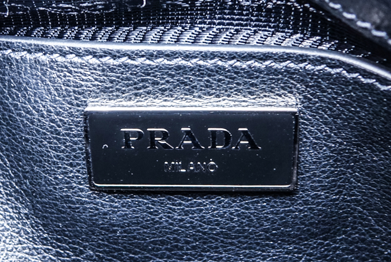 Prada Sky Blue/Black Leopard Print Pony And Suede Heaven Bag PM. Silver tone hardware, the interior of black signature fabric with zippered and patch pockets, black leather handles.